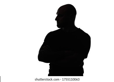 Silhouette of bald man with arms crossed on white background