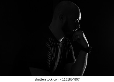 Silhouette Of A Bald Man On A Black Background