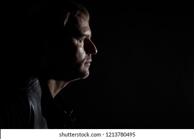 Silhouette Of A Bald Man On A Black Background