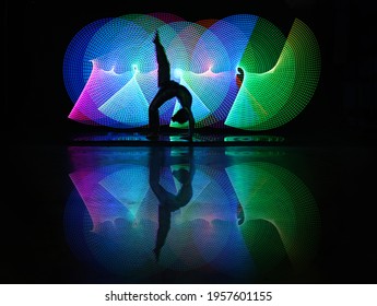 Silhouette Of Ballet Dancing Woman, Beyond Light Painting Photography Technique At Black Background