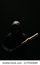 Silhouette Of Bandit In Hoodie Holding Baseball Bat Isolated On Black