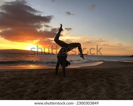silhouette beach sunset handstand yoga
