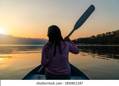 Silhouette Beautiful body positive chubby girl woman kayak happy peace placid adventure travel holiday vacation panorama landscape view sunset lake river boat canoe water reflection sky forest trees - Powered by Shutterstock