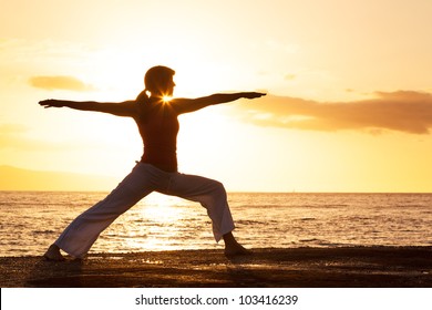 Silhouette Of A Beautiful Yoga Woman In The Morning