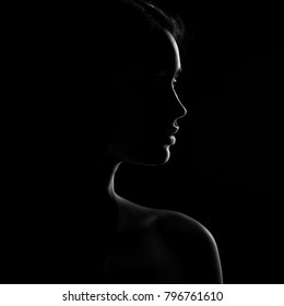 Silhouette Of Beautiful Young Woman Isolated On Black Background