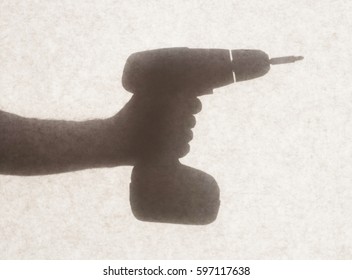 Silhouette behind a transparent paper - Cordless drill - Powered by Shutterstock