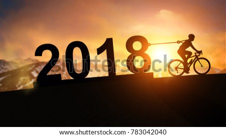 silhouette bicycle pull 2018 Text to sunset mountain background in Happy New Year Concept