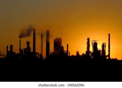 Silhouette Of Big Oil Refinery Factory  During Sunset