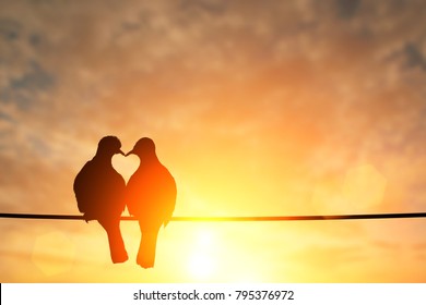 silhouette of bird in heart shape on pastel background and Valentine's Day  - Shutterstock ID 795376972