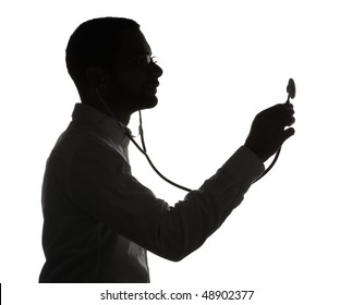 Silhouette of black doctor with stethoscope, isolated on white background.