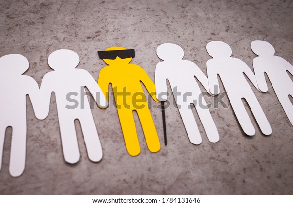 The silhouette\
of a blind man with a cane and glasses. People stand in a line and\
support the yellow figure by the hands. A disabled person is a\
full-fledged part of\
society.