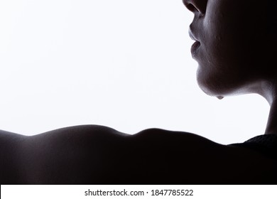 Silhouette Body Of Young Fitness Woman Who Has Hot Sweat From Exercise, Sweaty From Chin Face Part. High Contrast White Background Copy Space