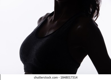 Silhouette Body Of Young Fitness Woman Who Has Hot Sweat From Exercise, Sweaty On Neck Chest Part. High Contrast White Background Copy Space