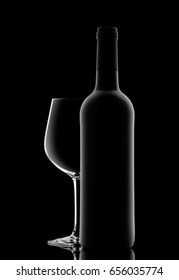 Silhouette of a bottle with wine on a black background