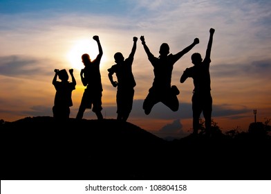 Silhouette Of Boy Happy And Victory  Together