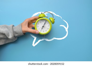 The Silhouette Of The Brain And The Alarm Clock In It. The Need To Remember About Time