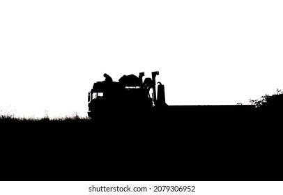 Silhouette Of A British Army Soldier Navigating From The Cabin Roof Of A MAN SV 8x8 EPLS Truck On A Military Exercise, Wiltshire UK  