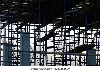 silhouette of building concrete structures with rebar against the background of the sunset sky. background. blank for the designer. for an article about construction or building infrastructure - Shutterstock ID 2231368509