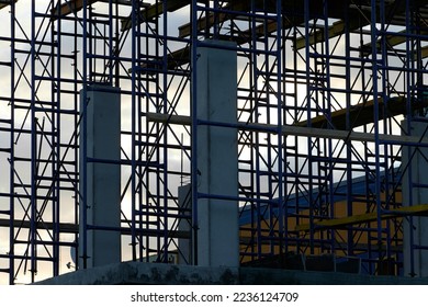 silhouette of building concrete structures with rebar against the background of the sunset sky. background. blank for the designer. for an article about construction or building infrastructure - Shutterstock ID 2236124709