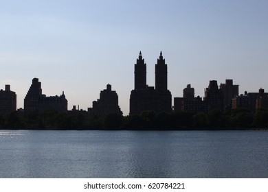 Silhouette Of Buildings In Front Of Jackie Kennedy Reservoir 