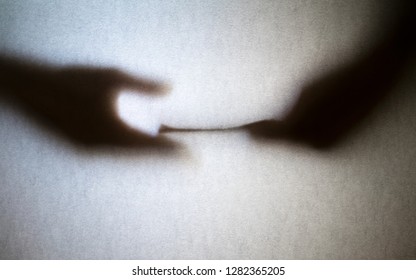 Silhouette Of Business Man Hands Giving Bribe Isolated On Gray Background