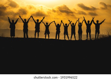 The silhouette of a business network group of business people shaking hands to express the joy and celebration of the success of the marketing and business operations between companies - Powered by Shutterstock