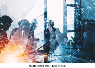 Silhouette of business people work together in office. Concept of teamwork and partnership. double exposure with network effects - Shutterstock ID 1235642833