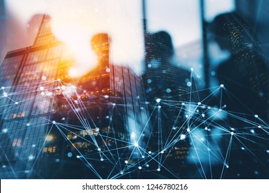 Silhouette of business people work together in office. Concept of teamwork and partnership. double exposure with network effects - Shutterstock ID 1246780216
