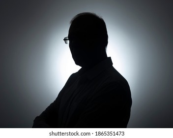 Silhouette Of Businessman. Male Shadow On Backlit. Profile Of Black Man In Eyeglasses.