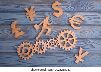 silhouette of businessman running on gears, surrounded by symbols of currencies dollar, euro, franc. yen, yuan. Business idea is a concept of strategy. Career growth teamwork - Powered by Shutterstock