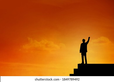 Silhouette of  Businessman stand on the top of stairs , archievement , success and leadership , hight level of team