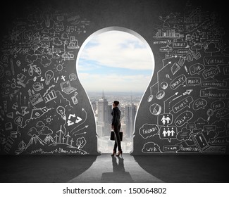 Silhouette of businesswoman against black wall with key hole - Powered by Shutterstock