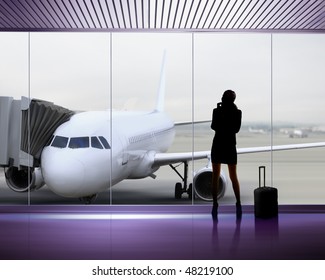 Silhouette Of Businesswoman Which Expects Flight Aboard The Plane At Airport