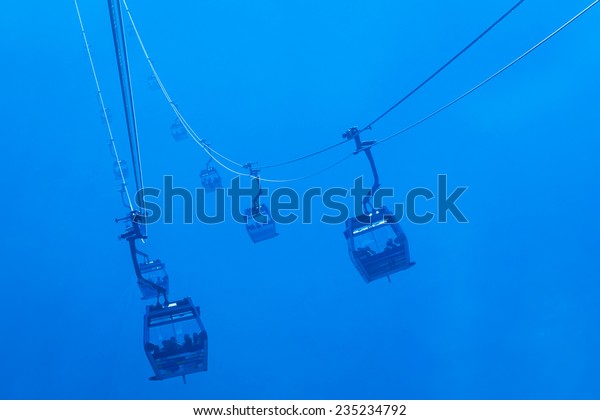 Silhouette Cable Cars in\
fog