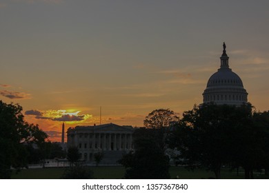 Silhouette Of Capitol Hill And Washington Monument In Downtown Washington DC Durign Twilight In A Sunset With Some Clouds