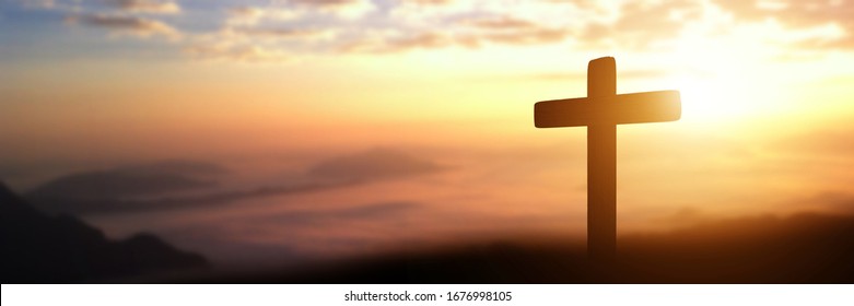Silhouette of catholic cross at sunset background. Crucifixion of jesus christ panorama picture