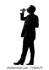 silhouette caucasian business man  expressing drinking behavior full length on studio isolated white background
