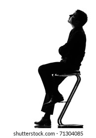 Silhouette Caucasian Business Man Thinking Pensive Sititting On Foot Stool Full Length On Studio Isolated White Background