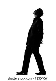 Silhouette Caucasian Business Man  Walking Musing Looking Up Expressing Behavior Full Length On Studio Isolated White Background