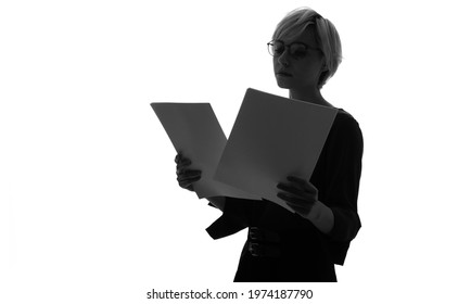 Silhouette of caucasian woman holding document papers. - Powered by Shutterstock