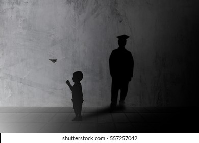 Silhouette Children Playing Paper Airplane And Learn In Order To Strengthen Imagine Casting A Shadow Graduated Up To The Job On A Concrete Wall. Learning And Teaching Concept.