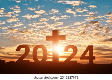 Silhouette of Christian cross with 2024 years at sunset background. Concept of Christians new year 2024 - Shutterstock ID 2342827971