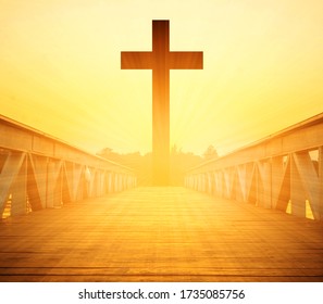 Silhouette christian cross and wooden bridge with over sunset - Shutterstock ID 1735085756