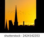 Silhouette of church steeple at sunset