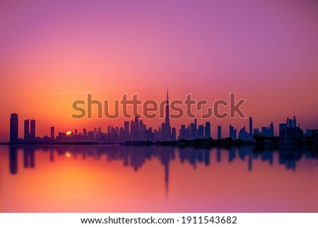 silhouette of city buildings during sunset , Dubai - United Arab Emirates