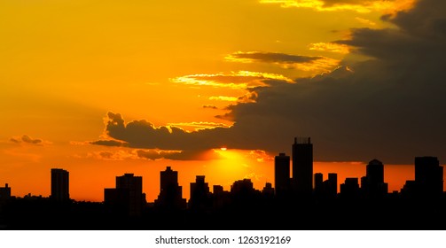 Silhouette City Sunset in Johannesburg South Africa with dramatic red and ornage sky