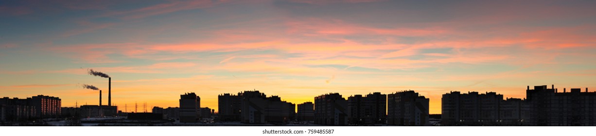 SILHOUETTE OF THE CITY WITH TUBES OF A PLANT ON THE DAWN - Shutterstock ID 759485587