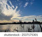 Silhouette of a city view with a cloudy sky near the Danshui river