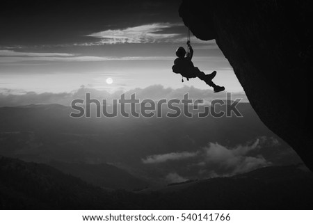 Similar – photographer in mountain at sunset