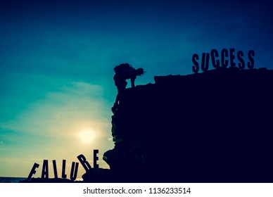 Silhouette Climber On The Cliff. Copy Space For Text On Blue Sky Background. Personal Transformation For Successful Concept. Business Development And Improvement.